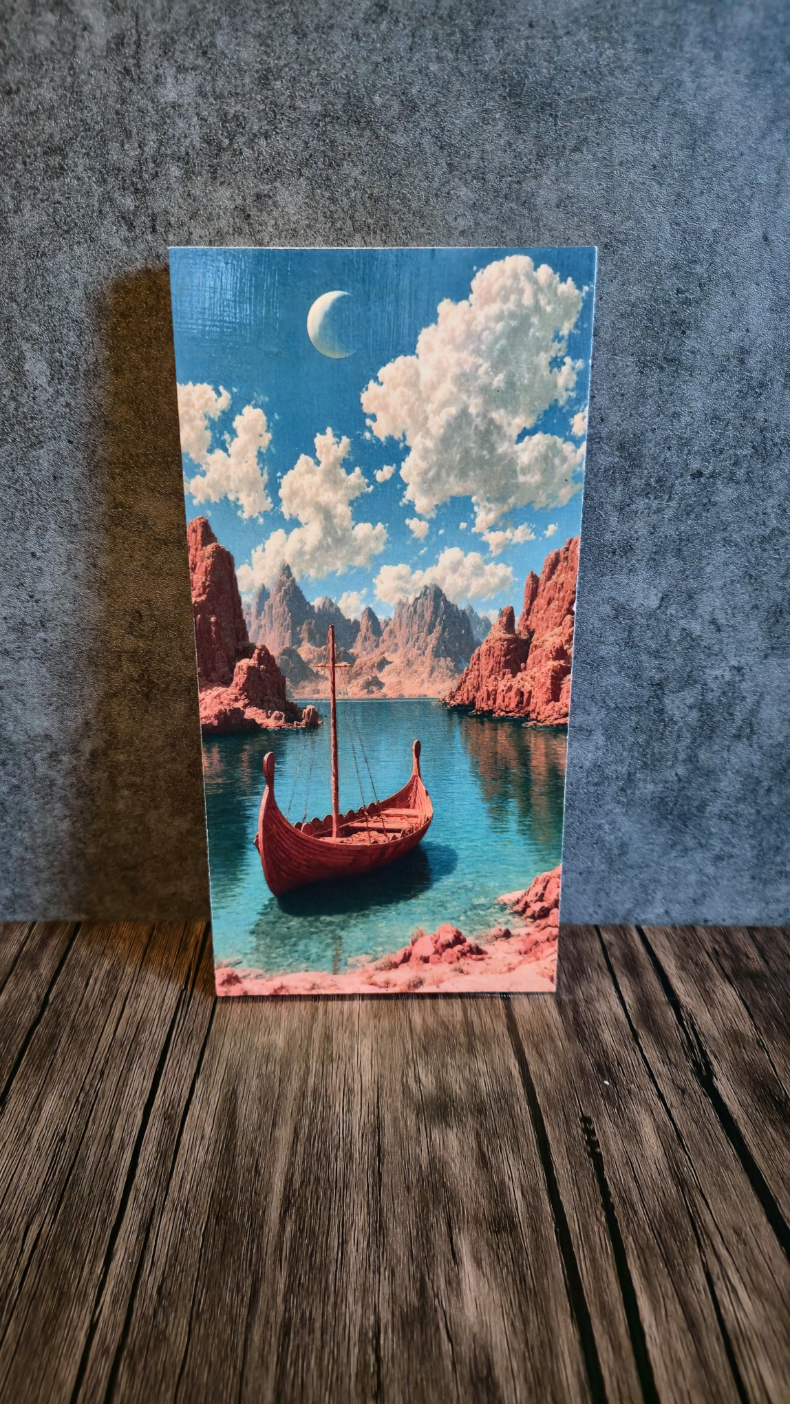 Long view of Norse ship with mystic landscape against a grey background.