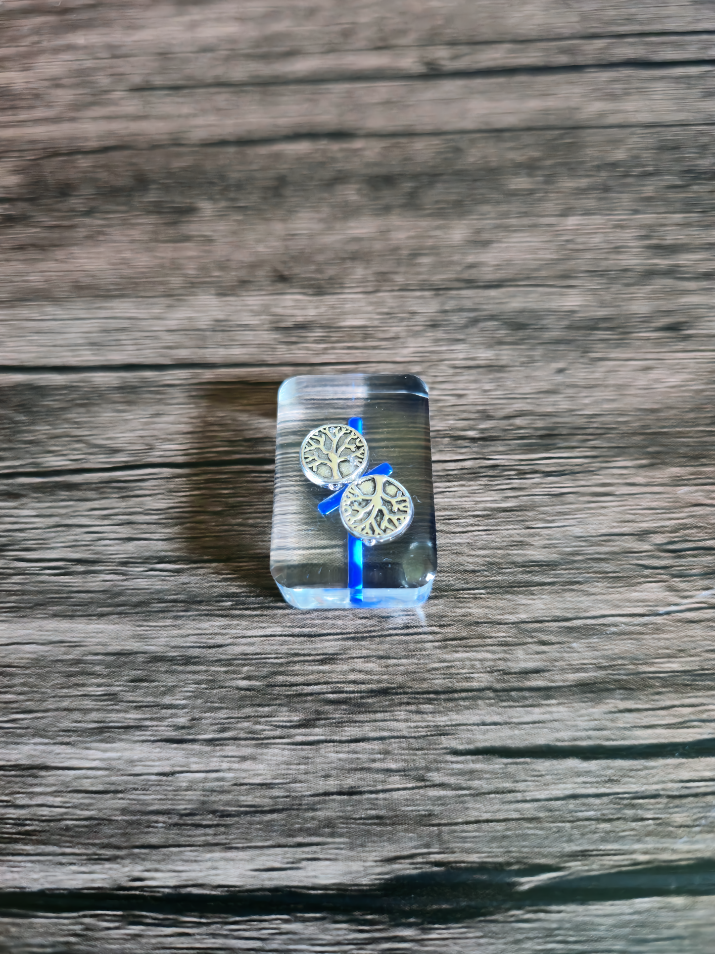 clear runestone highlighting the tree of life inside the clear runestone