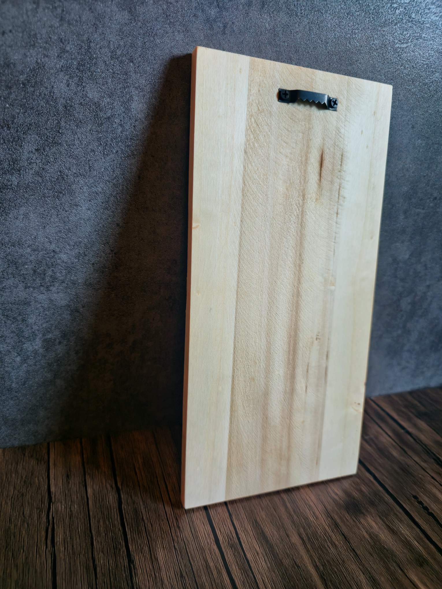 wood board with hanger on wooden table with grey background