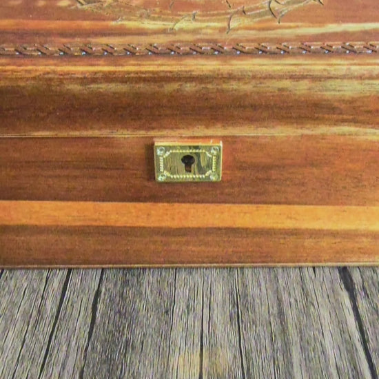video showing hand crafted box with Viking runes and world eater, brass fittings with brass lock