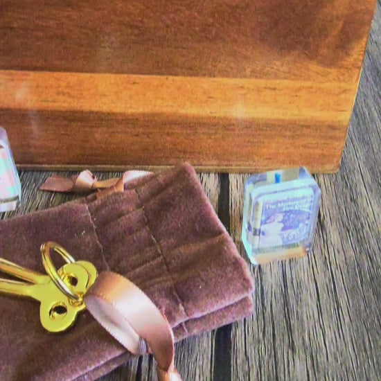 video of box set with brass keys, journal, cards, mini-book set and mat