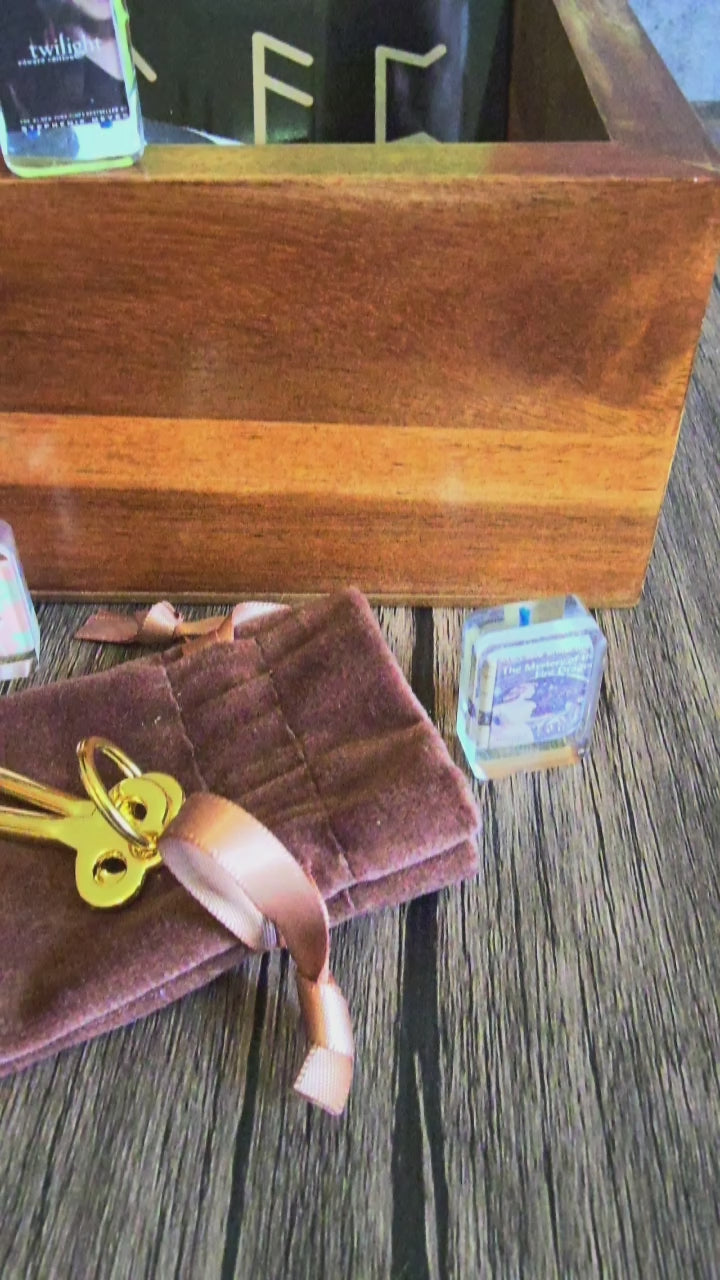 video of box set with brass keys, journal, cards, mini-book set and mat